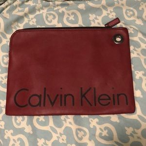Dark red male or female clutch. Brand new never used. No tags